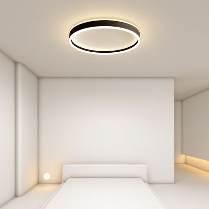 Modern Quinn Round LED Ceiling Light in a Bedroom Setting