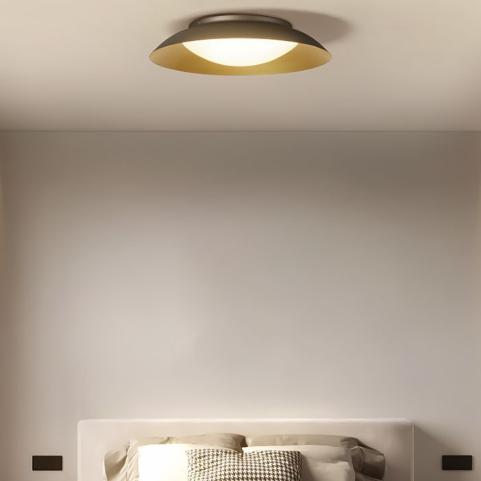 Brass Cairns flush mount ceiling light in bedroom
