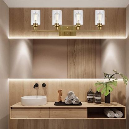 Gold Alessio vanity lamp with clear glass in modern bathroom. Alessio Modern Mirror Front Vanity Wall Lamp Metal Glass