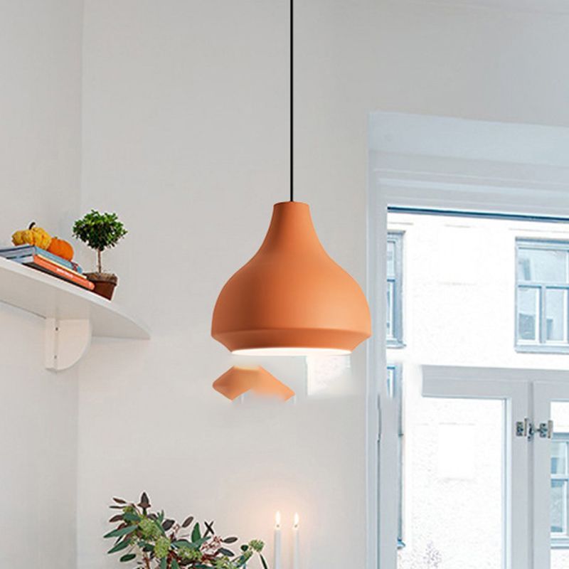 Orange Morandi pendant light in modern dining room.