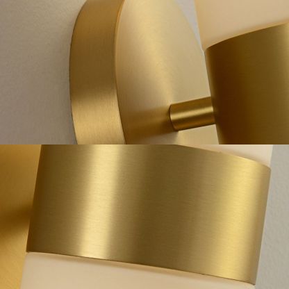 Brass metal & glass bedside wall lamp close up