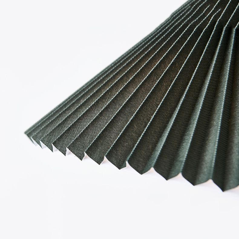 Close-up of pleated fabric lamp shade