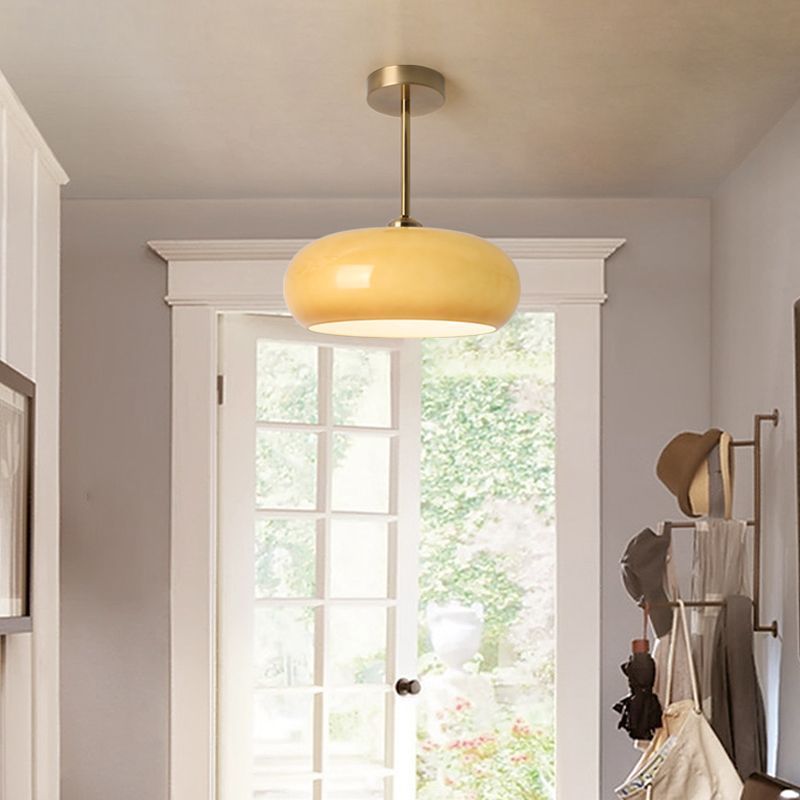 Amber glass round flush mount ceiling light. Modern hallway lighting.
