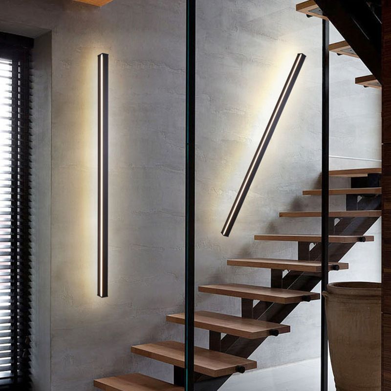 Edge Wall Lamps flanking stairs. Modern lighting by Las Sola.