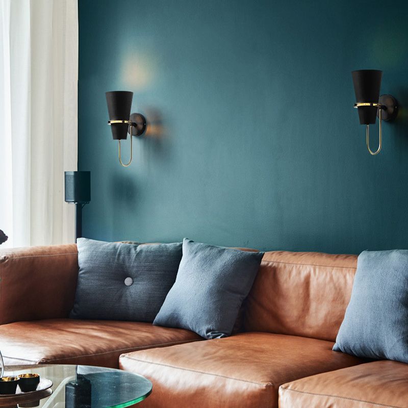Living room featuring Morandi cone metal wall lamps.