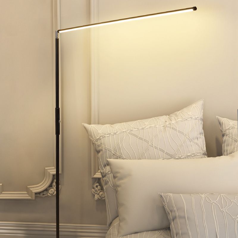 Minimalist metal floor lamp in bedroom setting