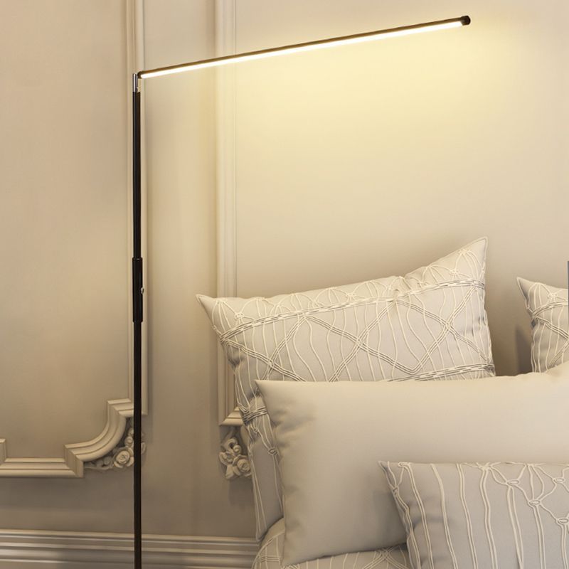 Minimalist metal floor lamp in bedroom setting