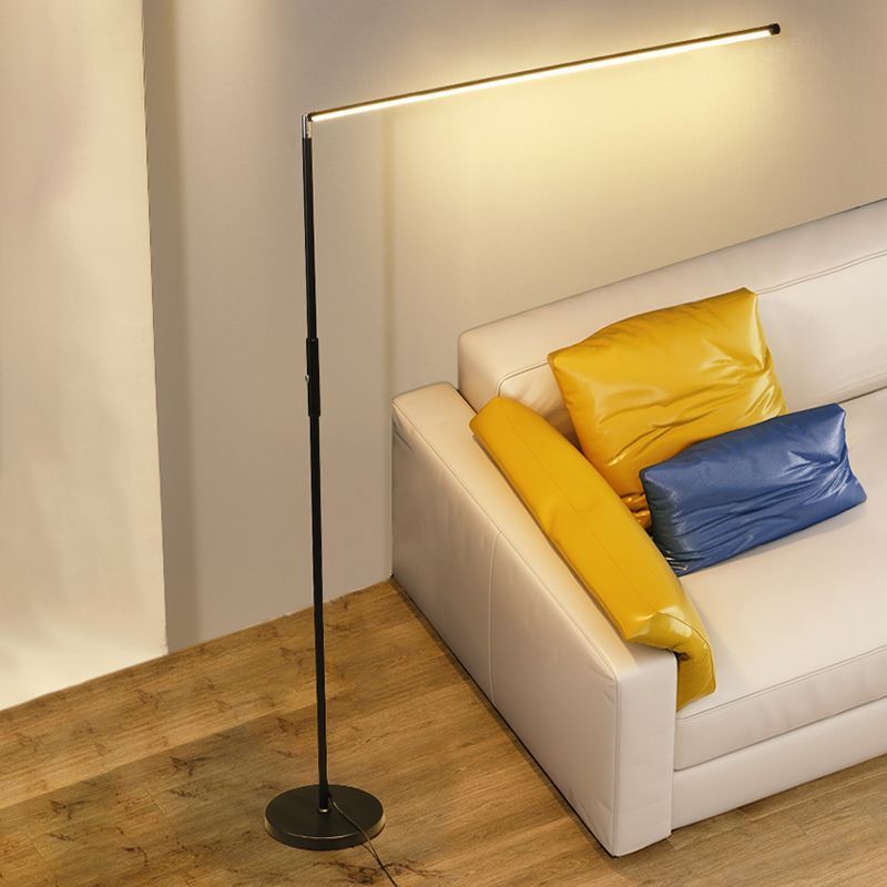 Minimalist Edge Floor Lamp illuminating living room.