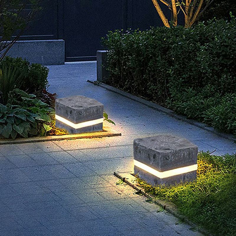 Pena Modern Stone Outdoor Lights illuminating pathway