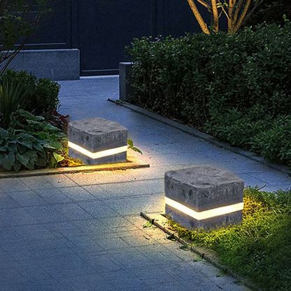 Pena Modern Stone Outdoor Lights illuminating pathway