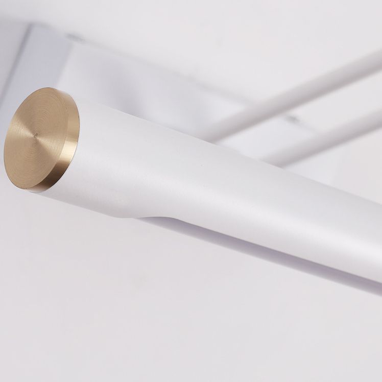 Modern white adjustable LED vanity wall lamp detail.