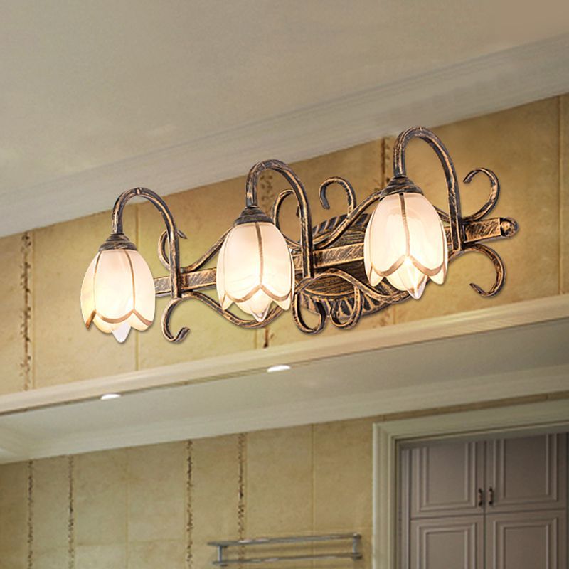Félicie Antique Brass Flower Wall Lamp in bathroom setting