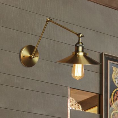 Brass Alessio adjustable wall lamp for bedroom lighting