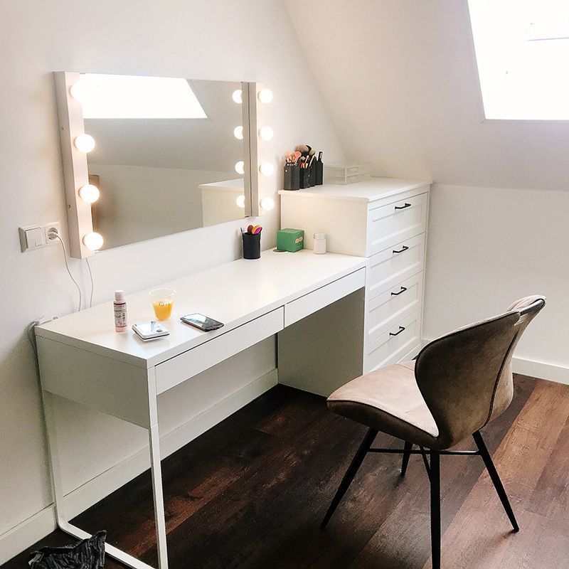 Modern vanity setup with metal wall lamp