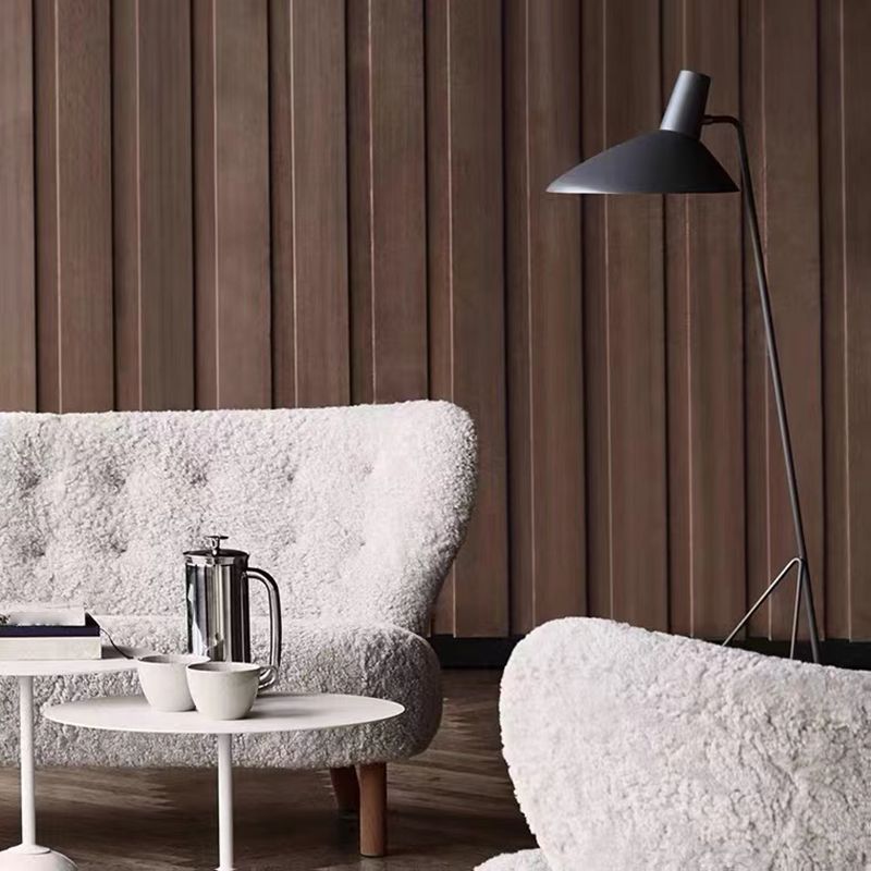 Modern floor lamp illuminates cozy living room