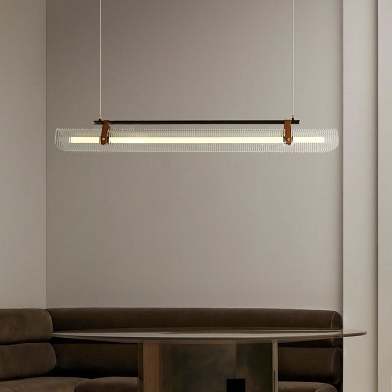 Modern linear pendant light, acrylic lampshade and metal fixture, over dining table