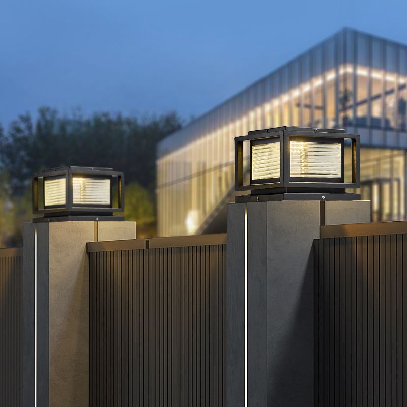 Riley black cube outdoor pillar lamps on the fence