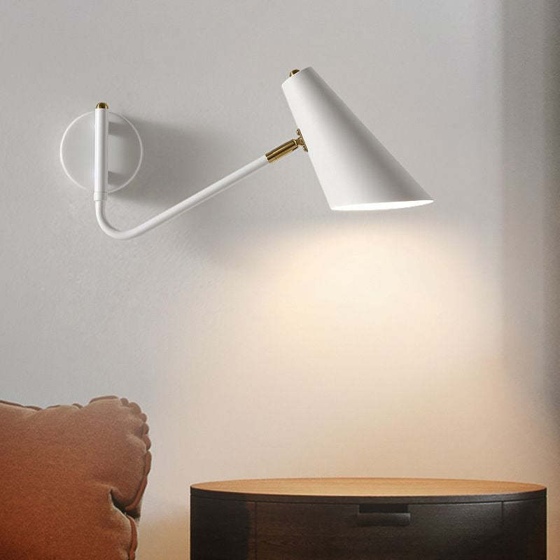 Brady White LED Wall Lamp above nightstand. Modern lighting.