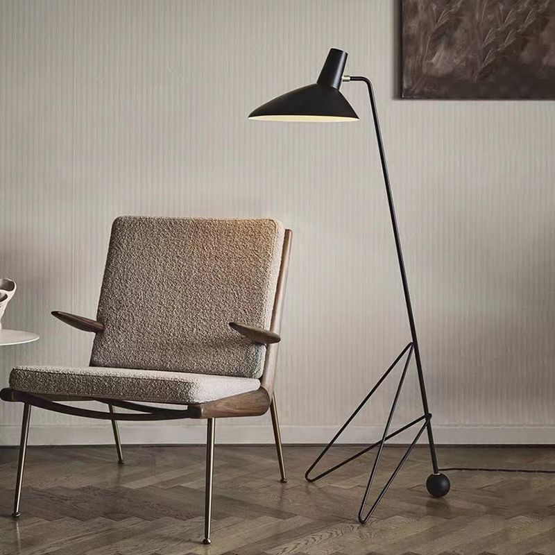 Salgado floor lamp beside a modern chair