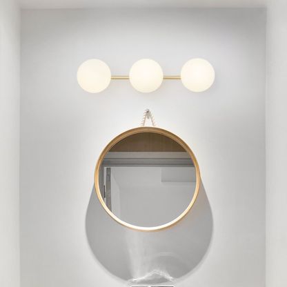 Modern bathroom wall lamp above a mirror