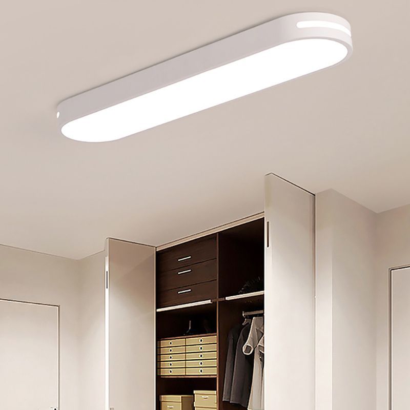 White Quinn Oval LED Ceiling Light in Bedroom