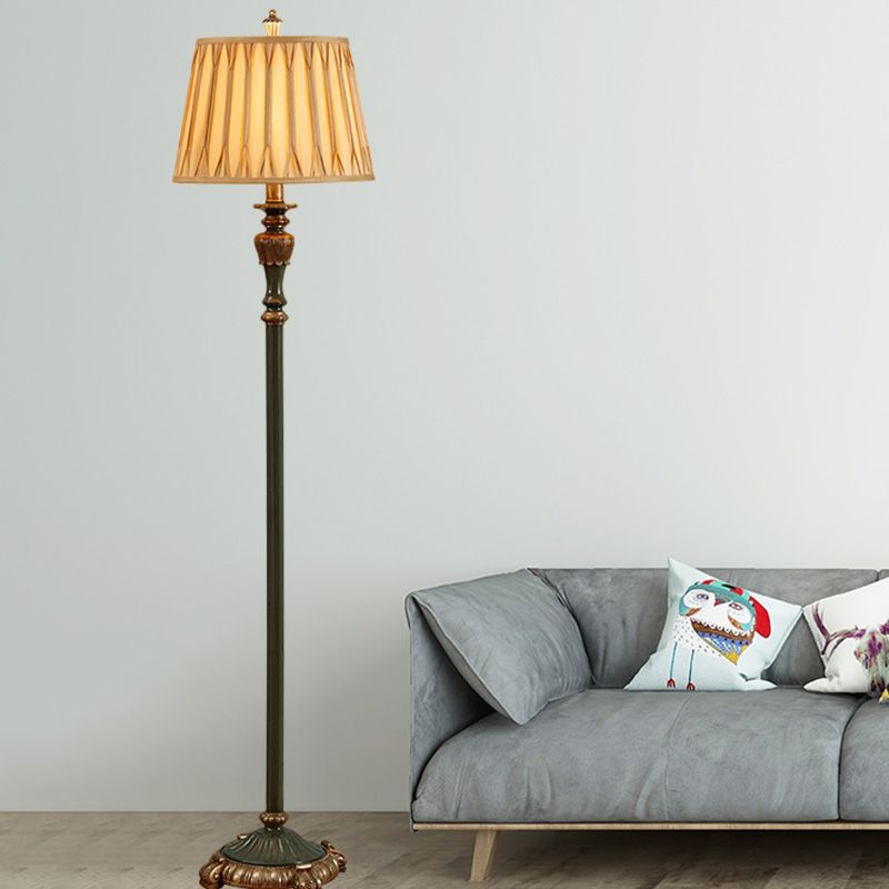 Eryn Floor Lamp illuminating living room with sofa