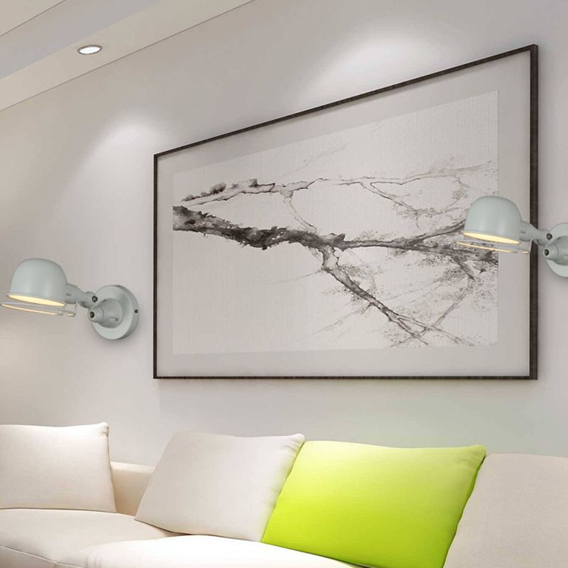 Modern gray Brady wall lamp, adjustable metal arm in bedroom setting