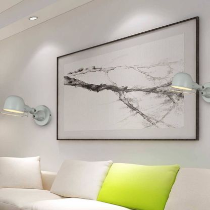 Modern gray Brady wall lamp, adjustable metal arm in bedroom setting