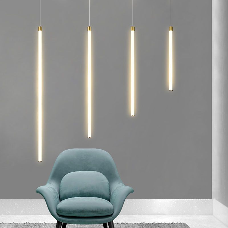 Linear LED pendant lights illuminating a living room
