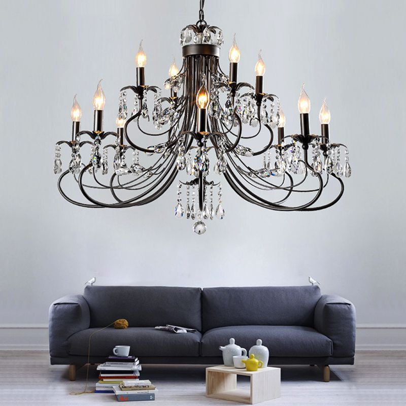Silva Crystal Chandelier over a grey sofa in a living room