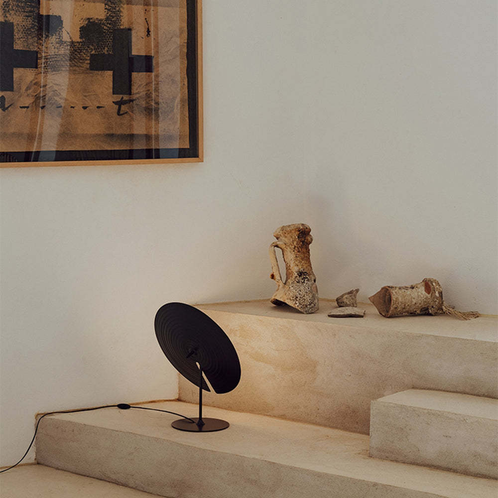 Carins metal table lamp on steps with art, modern lighting