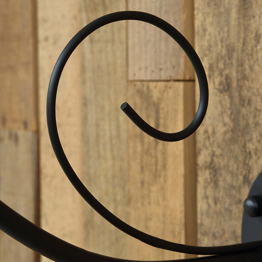 Swirl detail of Alessio vintage outdoor wall lamp.