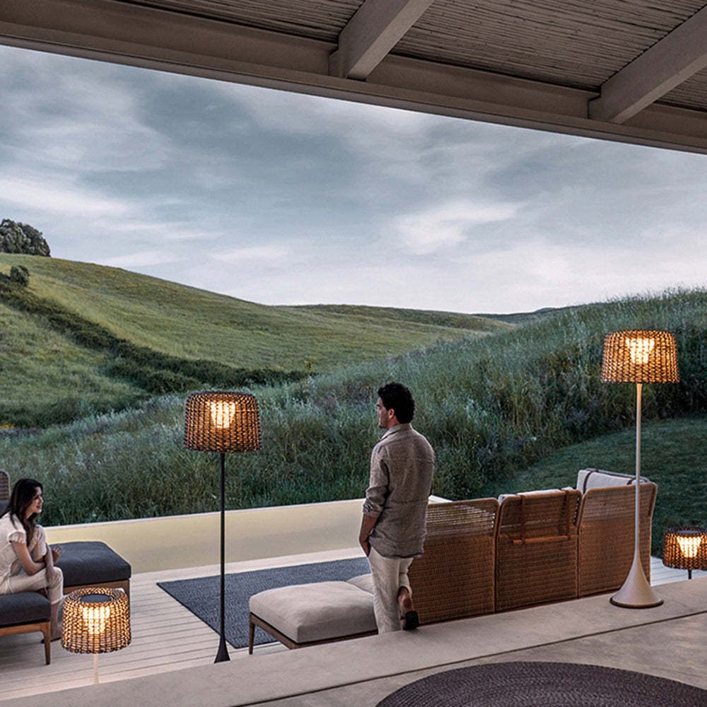 Lassola Ritta outdoor floor lamps illuminating a terrace with a view