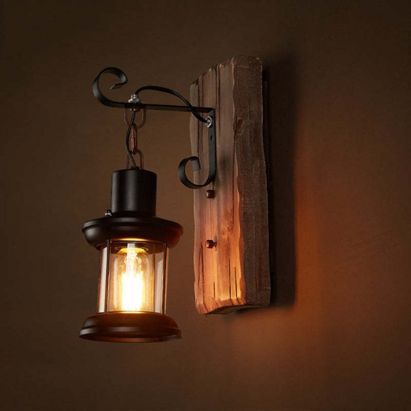Alessio bronze lantern wall lamp on wood. Vintage lighting solution.