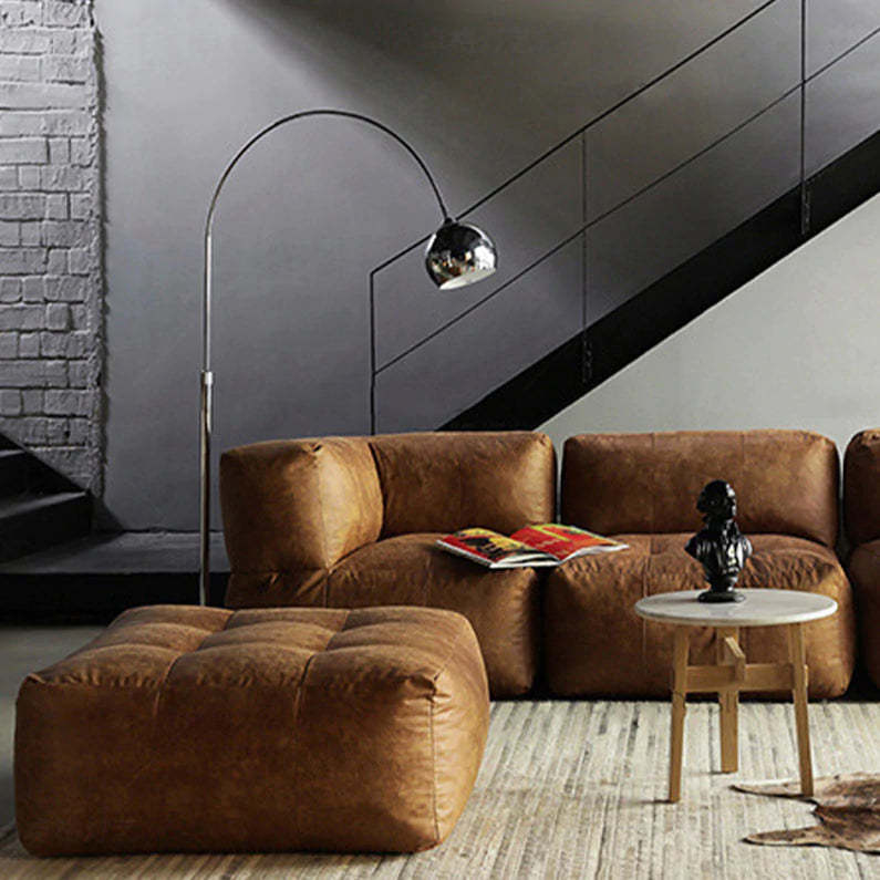 Arc floor lamp over brown leather sofa. Las Sola lighting. Morandi Modern Fishing 1 Light Arc Floor Lamp Metal