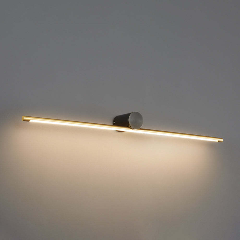 Leigh Wall Lamp - Gold finish and illuminating.