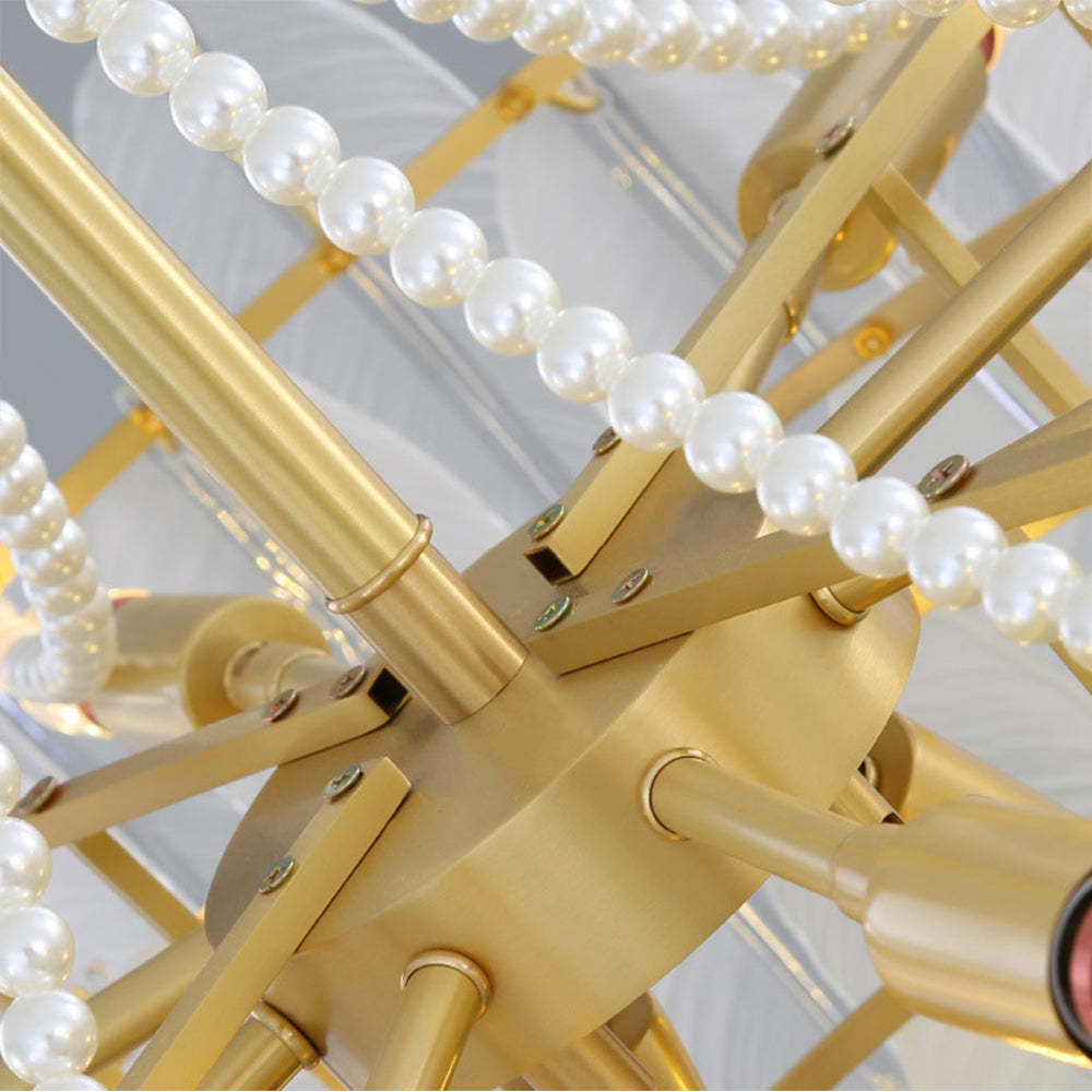 Close-up of Kirsten chandelier detail: gold metal, pearl accents, glass elements