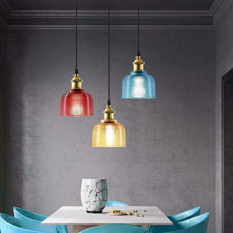 Colorful glass pendant lights in modern dining room