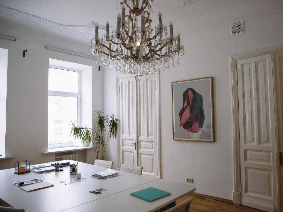 Classic meeting room showcasing an ornate vintage crystal chandelier.
