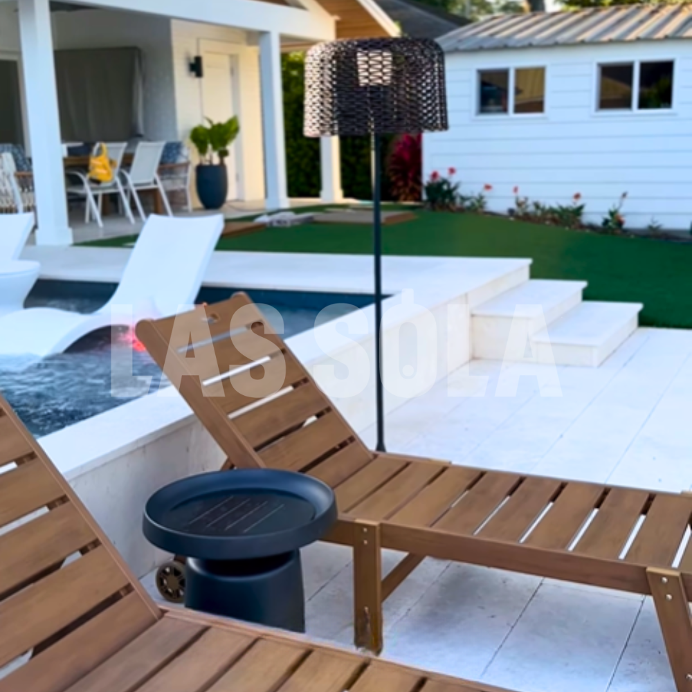 Pena Solar Outdoor Floor Lamp illuminating a patio setting