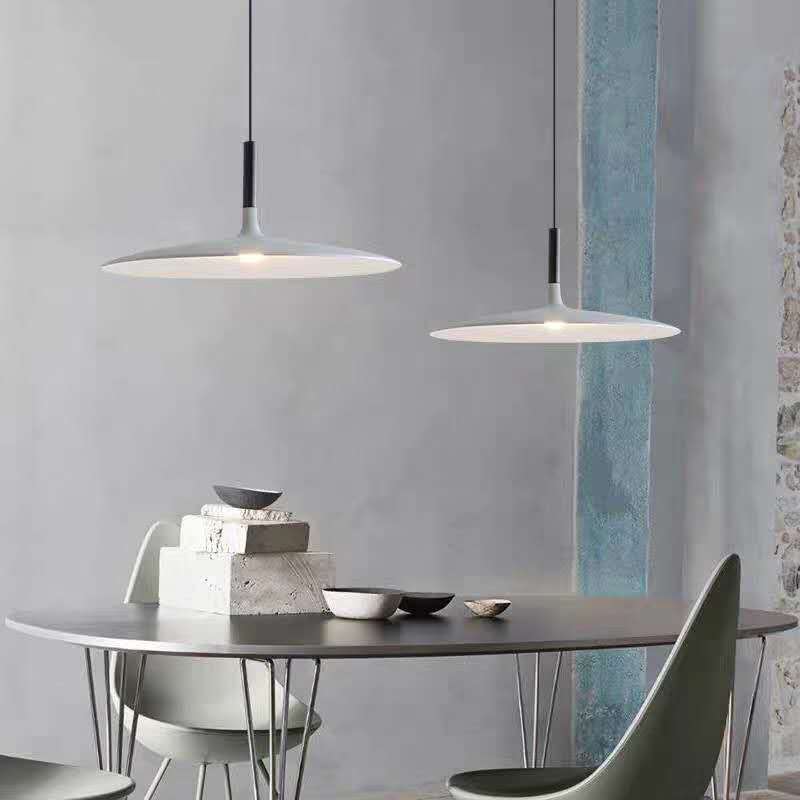 Modern Morandi pendant lights above a dining table
