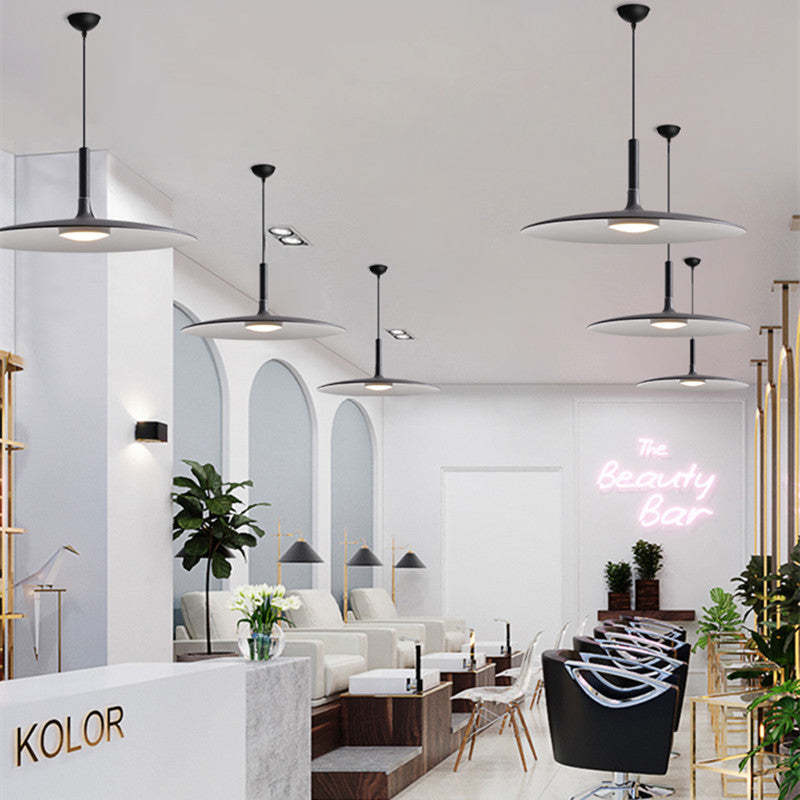 Morandi pendant lights in a modern beauty salon - plate shape