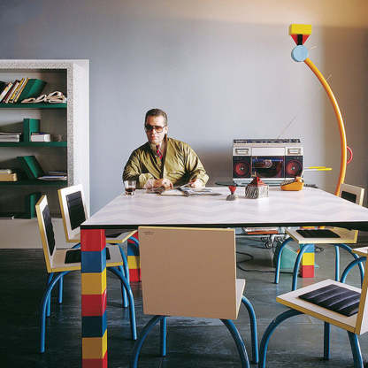 Morandi Lego Floor Lamp with man, colorful living room setting.