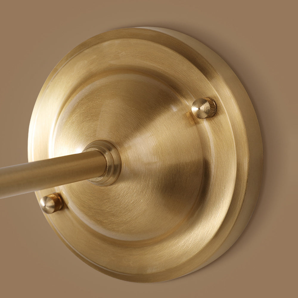 Close-up of gold Alessio vintage wall lamp base.