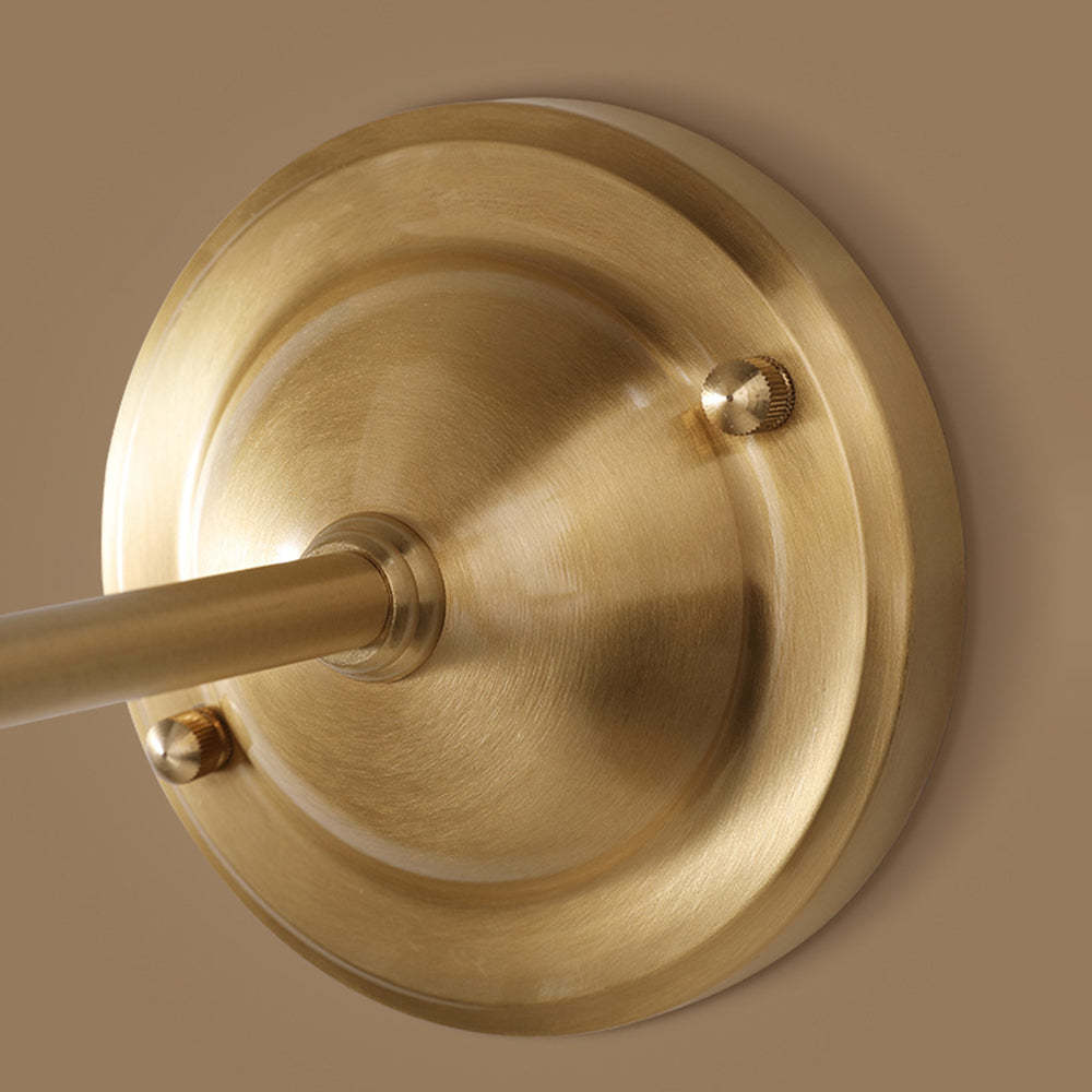 Close-up of gold Alessio vintage wall lamp base.