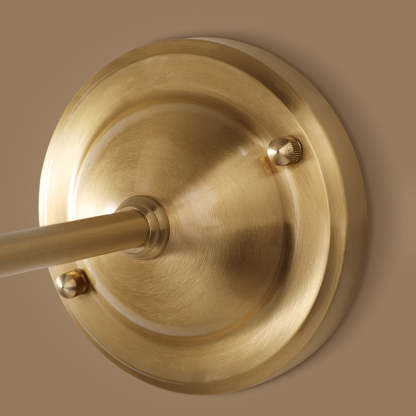 Close-up of gold Alessio vintage wall lamp base.