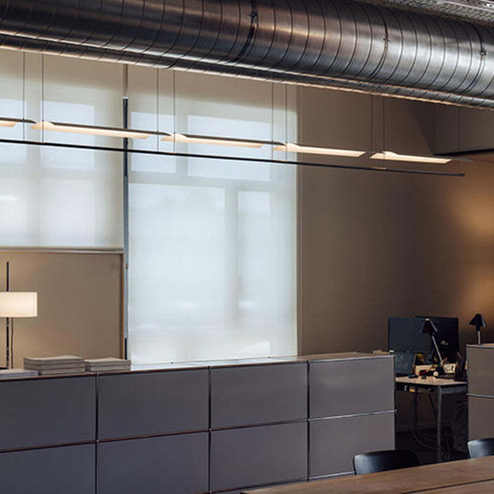 Office space lit by Edge minimalist pendant lights.