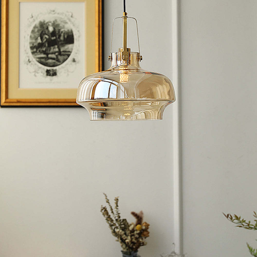 Hailie Pendant Light in room setting, amber glass shade