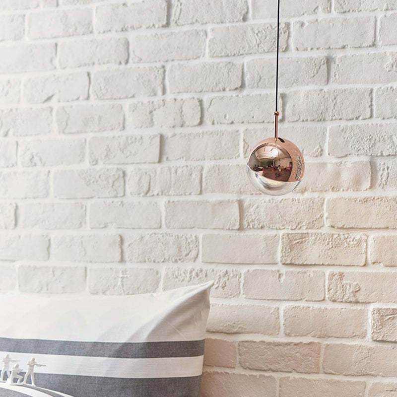 Valentina Ball Pendant Light - Rose Gold on white brick