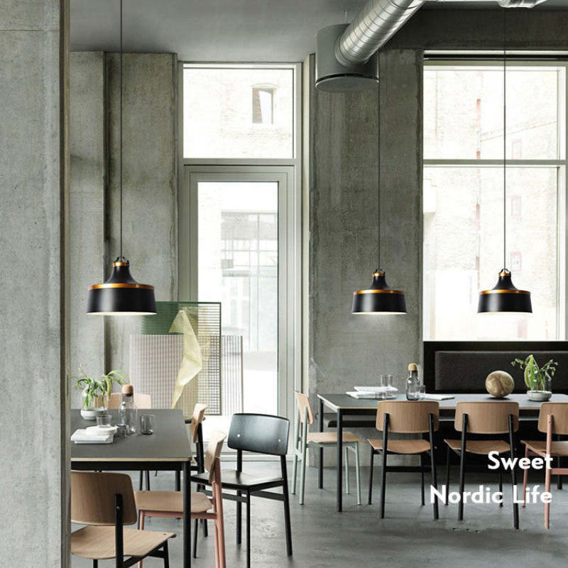 Morandi pendant lights illuminate a modern Nordic style dining space